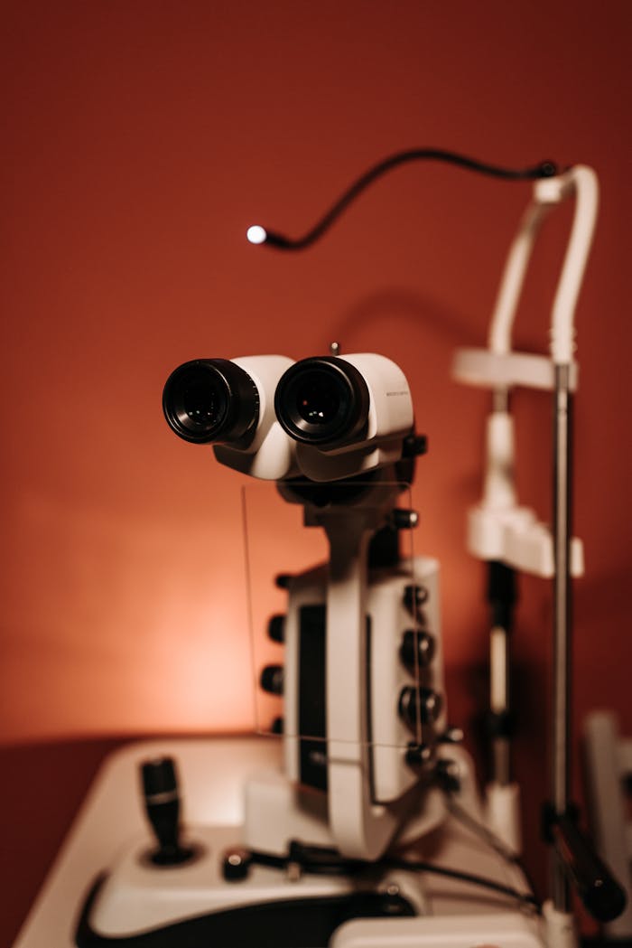 Detailed close-up of ophthalmology equipment used for eye examinations with a warm tone background.